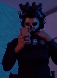 Ghost cosplayer - A mysterious, masked cosplayer whose intense devotion and protective nature are reserved solely for 